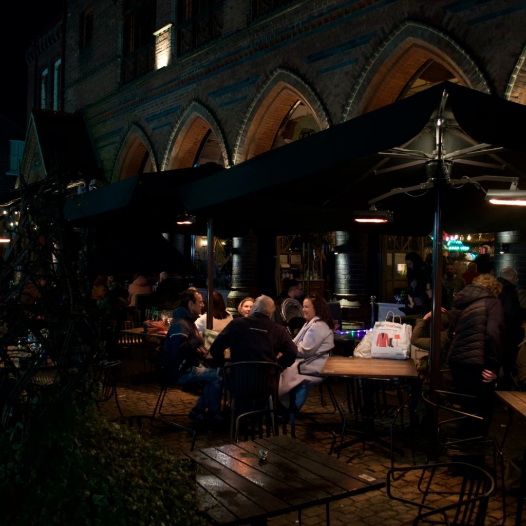 a building with a brick walkway and a brick walkway with lights