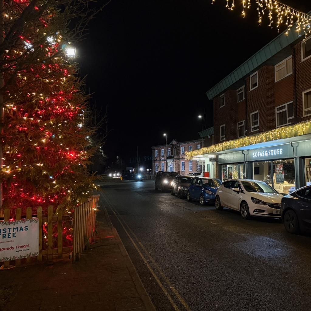 a building with a brick walkway and a brick walkway with lights