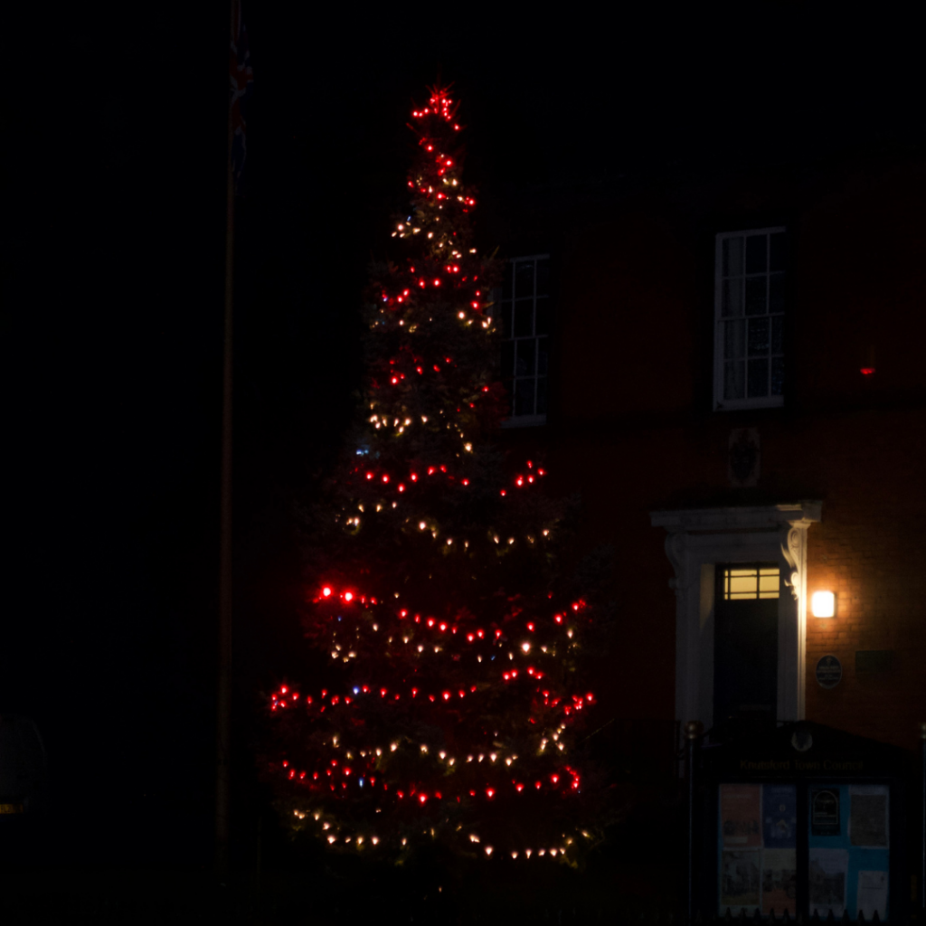 a building with a brick walkway and a brick walkway with lights