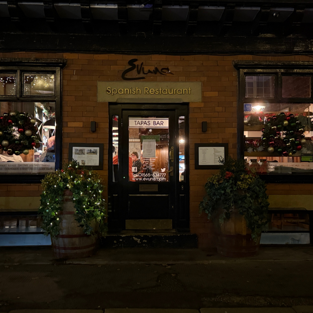 a building with a brick walkway and a brick walkway with lights